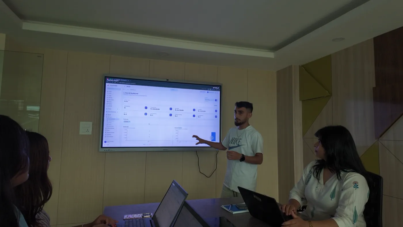 A NepalHRM team member presenting the HRMS attendance dashboard during a product standup